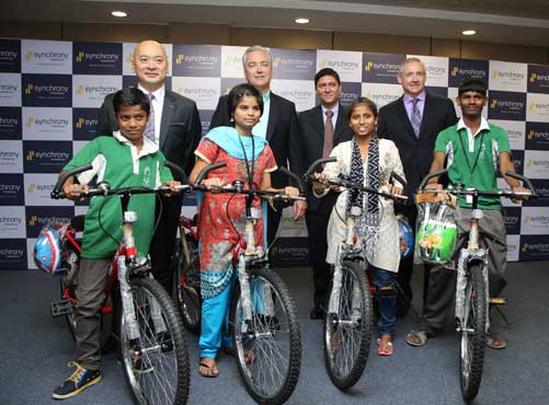Synchrony Financial donates bicycles to Don Bosco kids